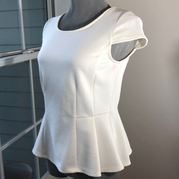 Striking Architectural Peplum Top - Picture 1 of 10